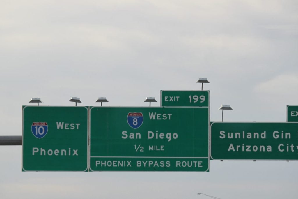 Overhead Interstate 10 west signs for Phoenix and San Diego in Arizona