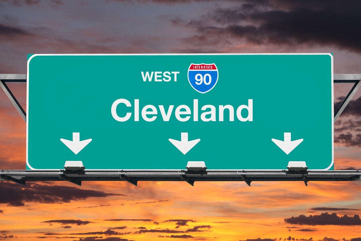Interstate 90 West sign for Cleveland at sunrise