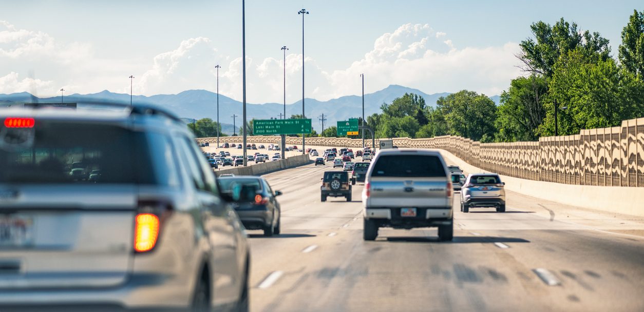 Vehicles traveling in lanes of daytime interstate traffic