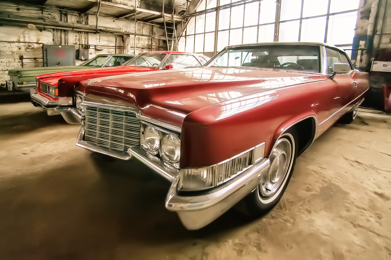 Classic American car parked in an old garage