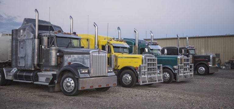 Row of classic American conventional tractor units