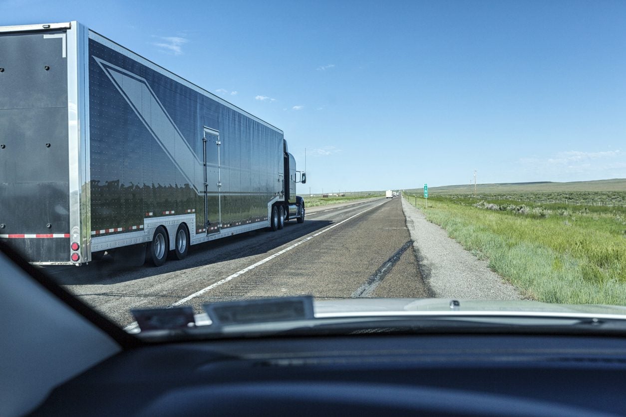 Enclosed trailer passing on a Wyoming expressway