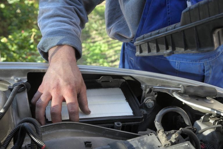 Mechanic working under the hood of a car
