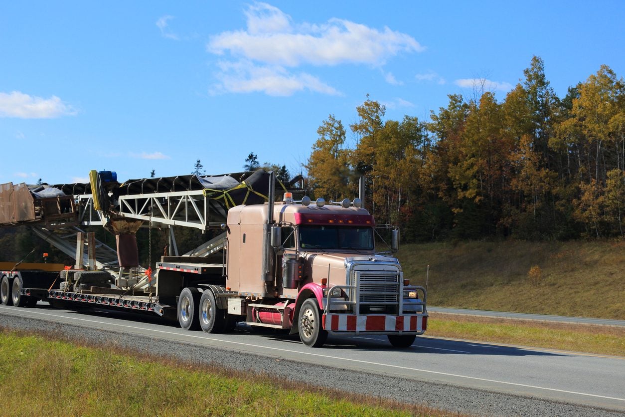 Tractor trailer carrying equipment on an interstate highway