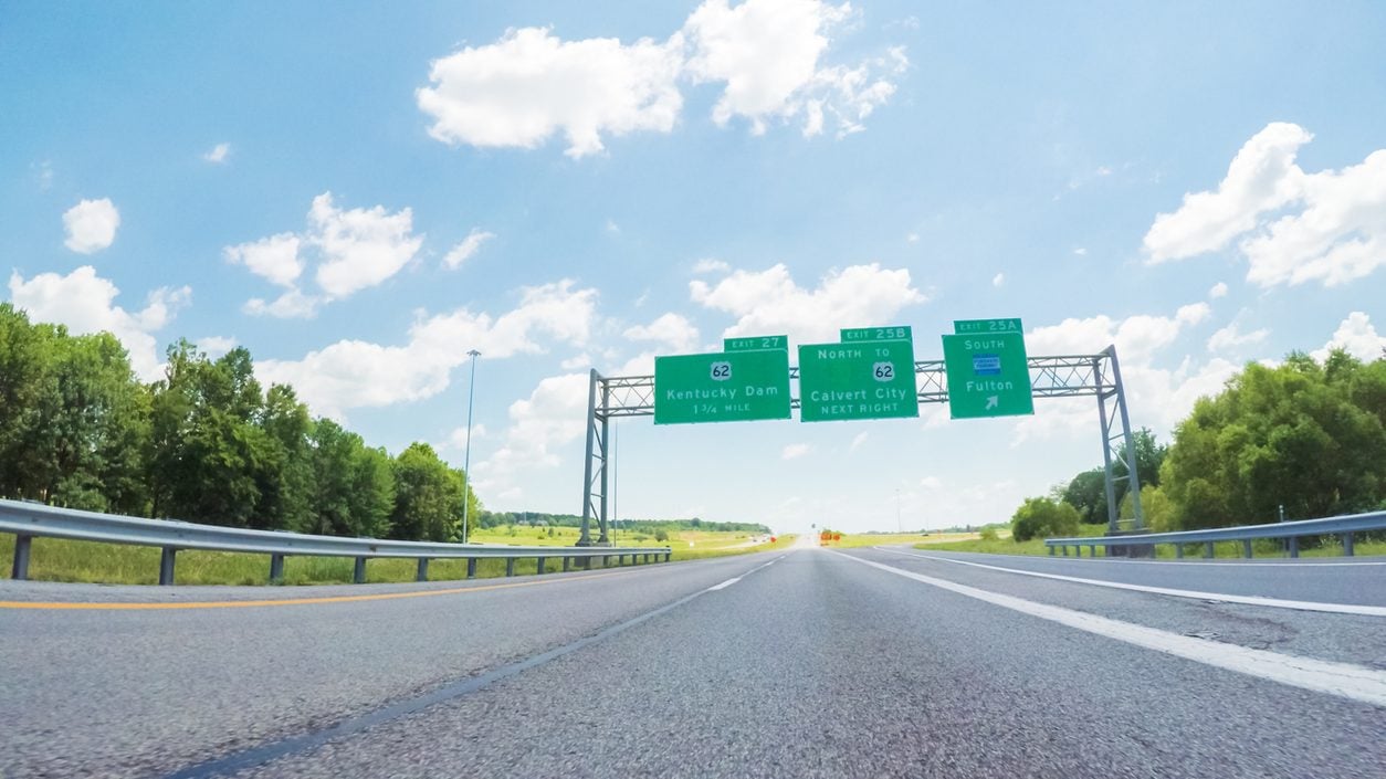 View along an interstate highway with overhead signs