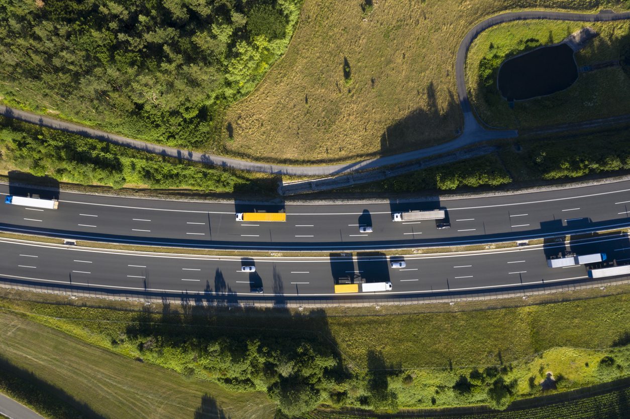 Aerial view of trucks on a divided multilane highway