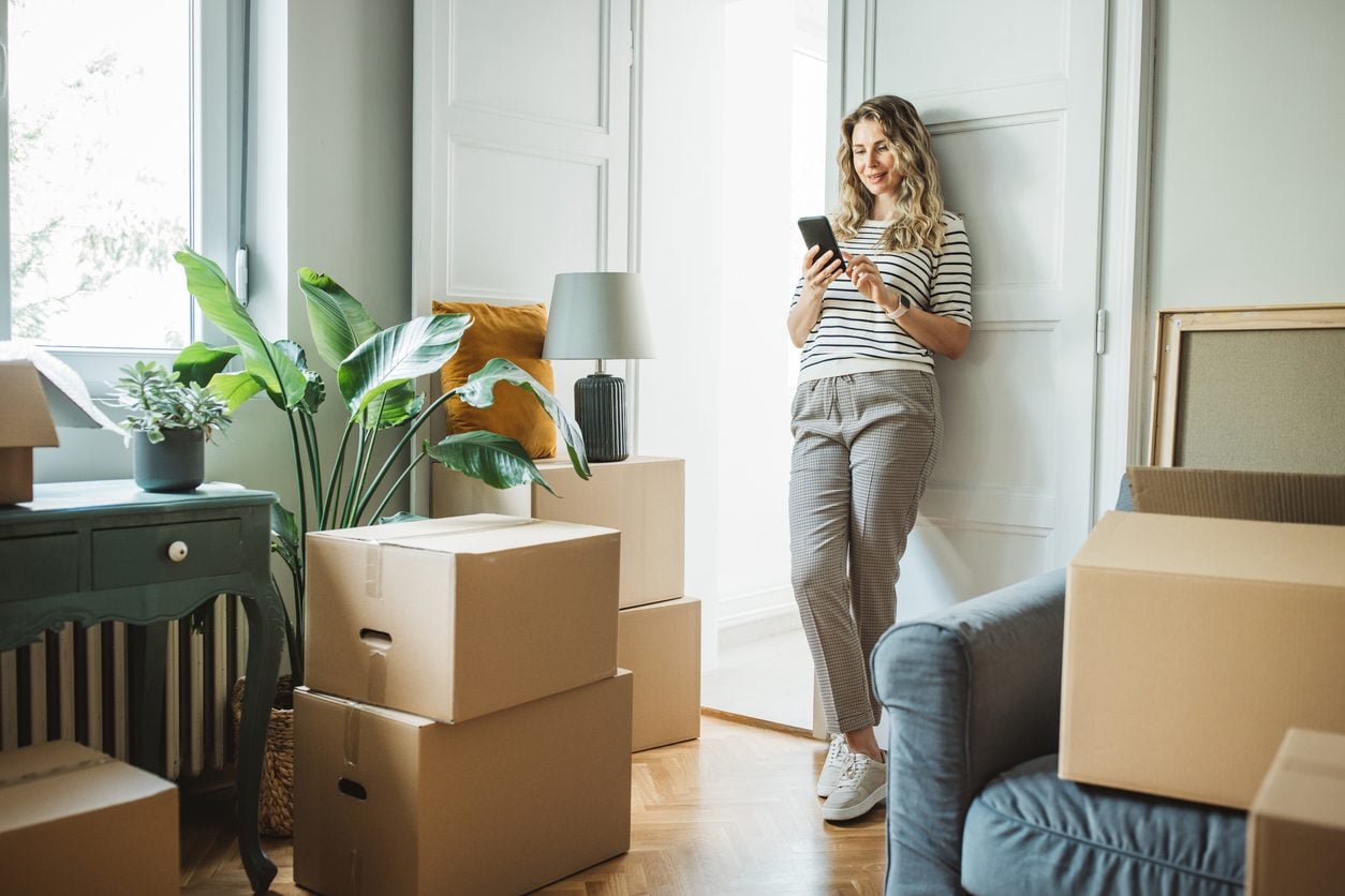 Moving boxes stacked in a new home after a relocation