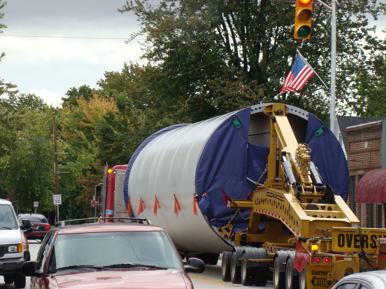 Oversize load moving through a town on a multi axle trailer