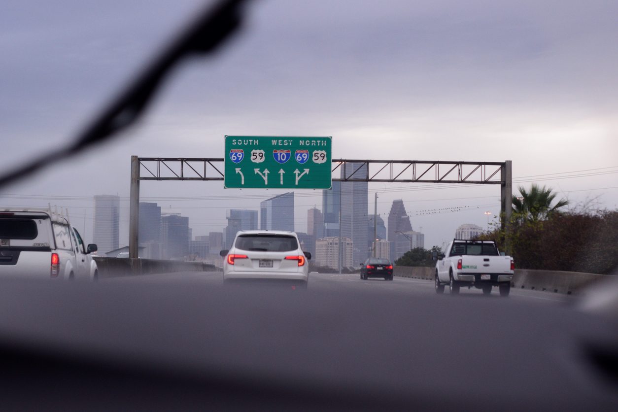 View through a windshield of highway traffic in heavy rain