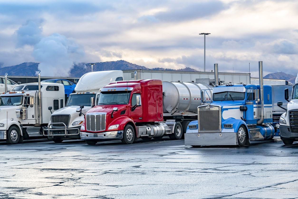 Loaded tractors and trailers at a truck stop