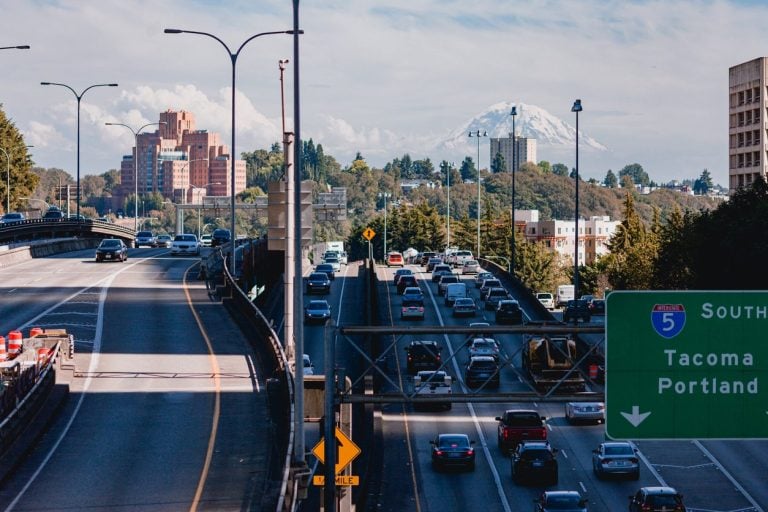Multiple lanes of congested interstate traffic on an urban overpass