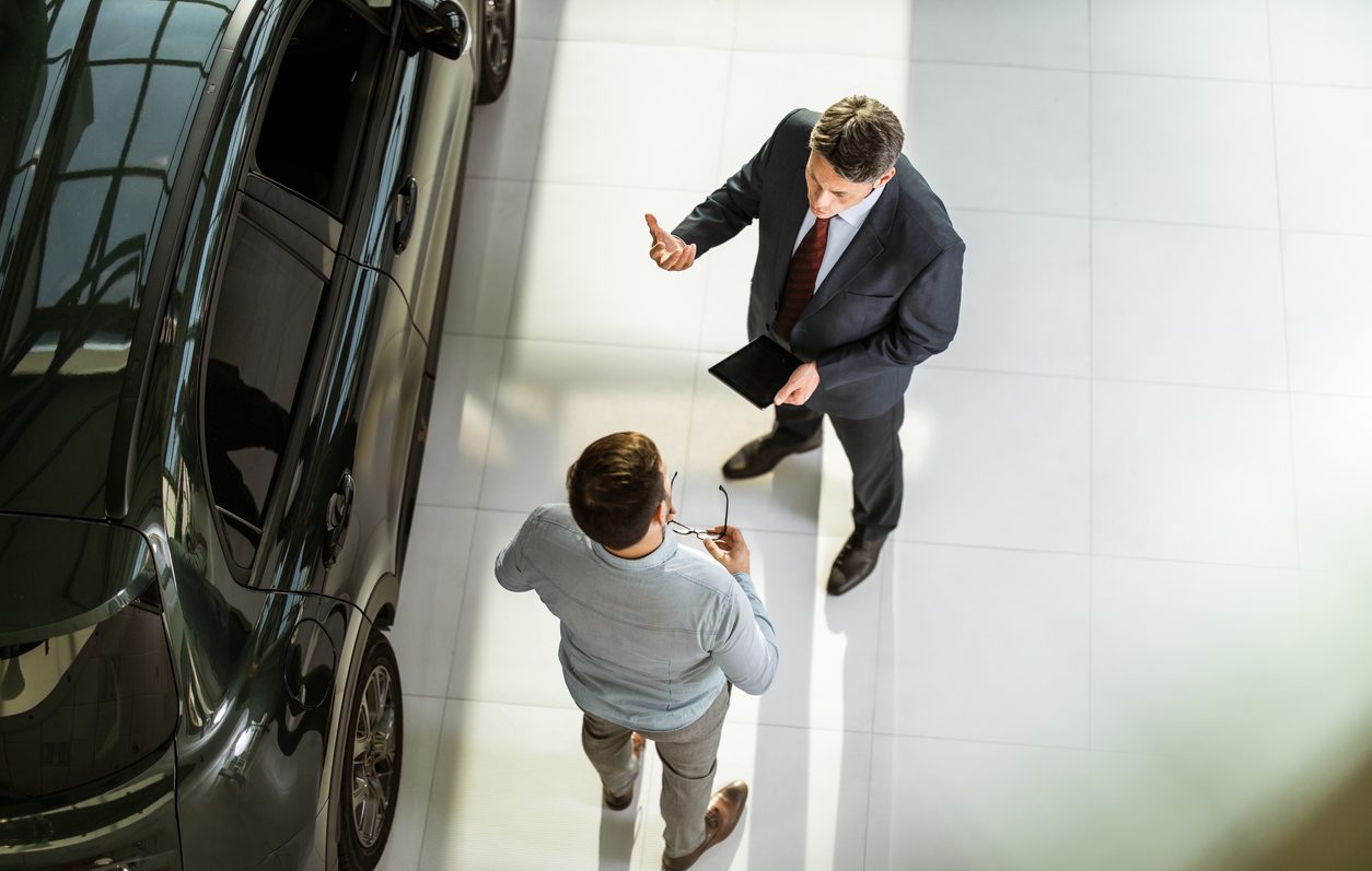 Customer and salesperson discussing a vehicle
