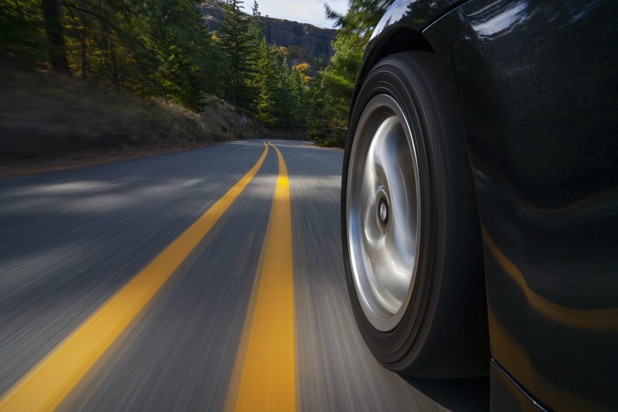 Sports car at speed on a country road