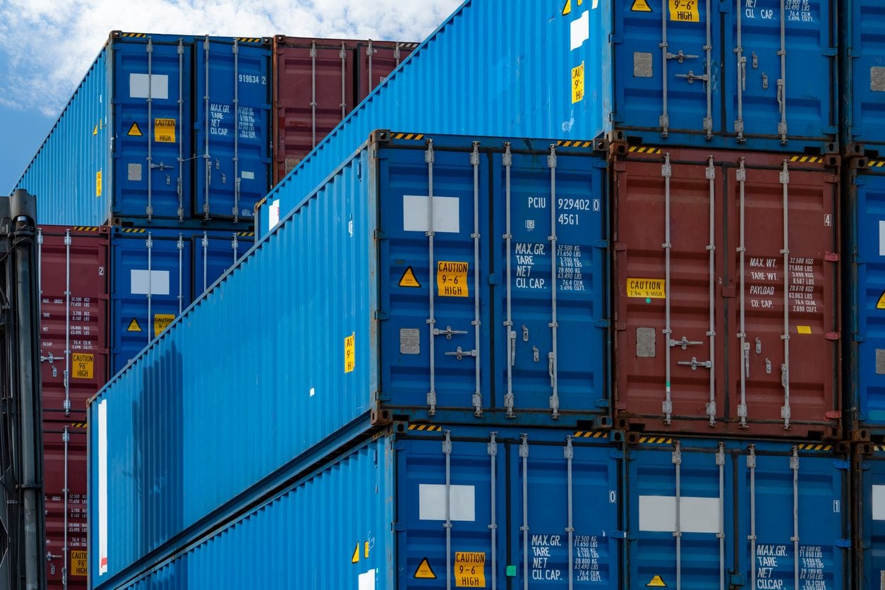 Stacked blue and red intermodal shipping containers