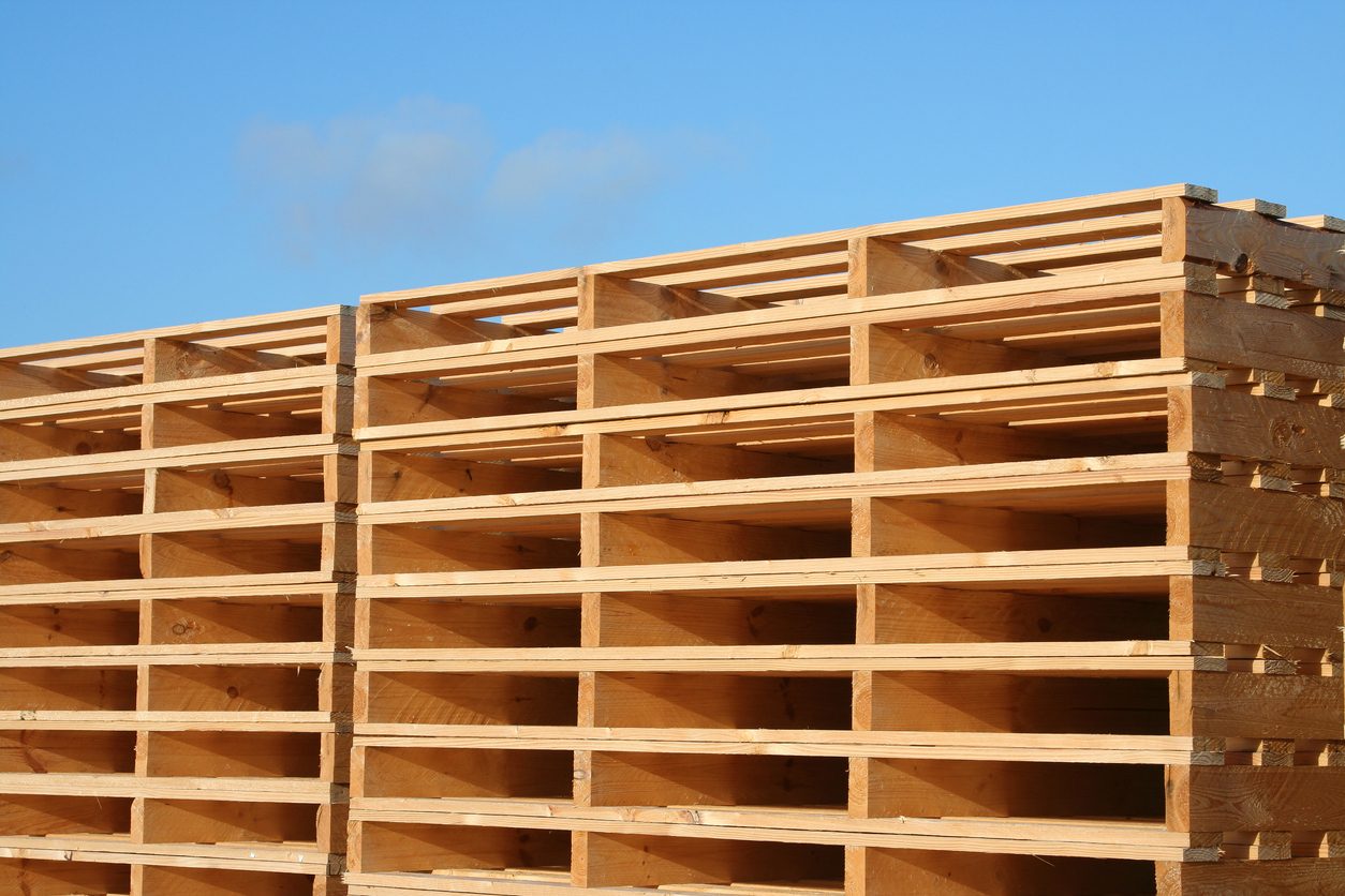 Stacked wooden pallets ready for loading