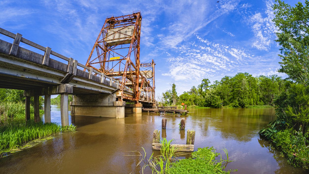 Steel truss bridge over a river on a rural route