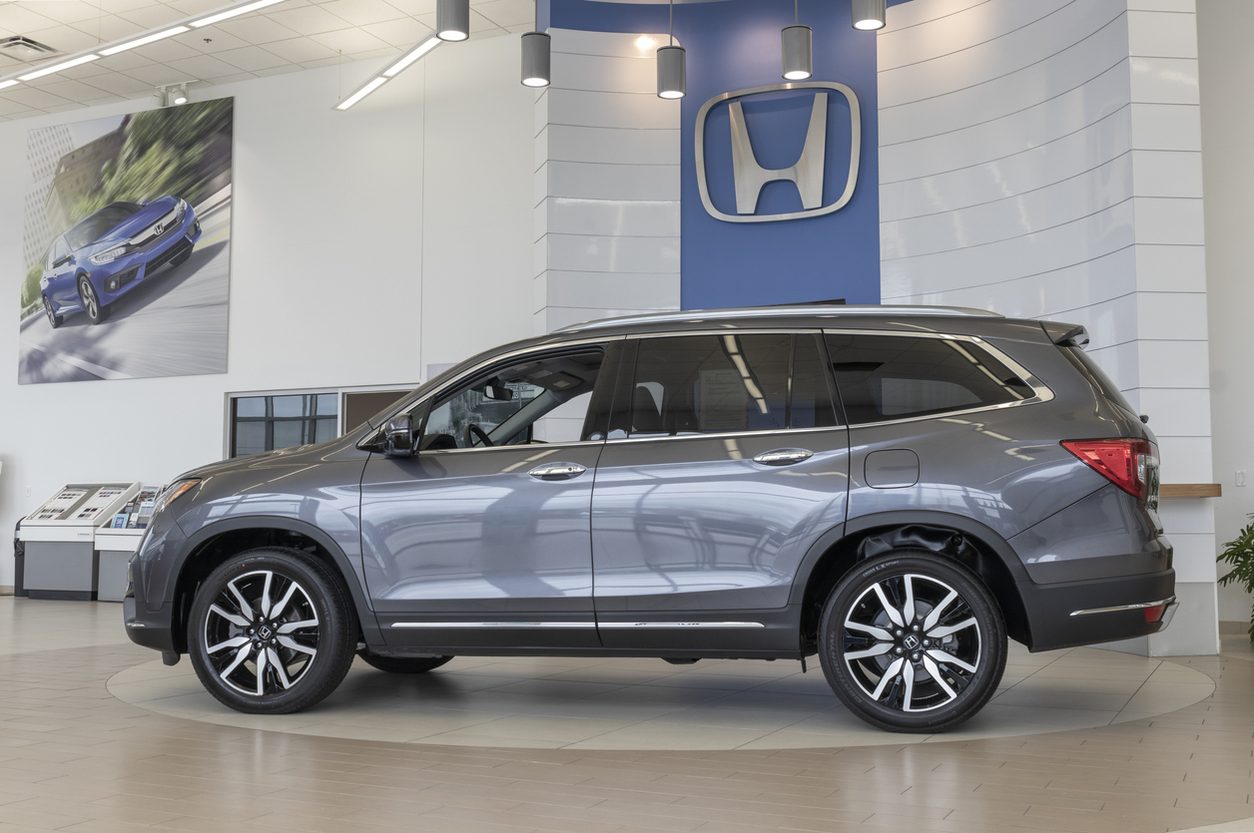 Mid sized SUV on display inside a dealership showroom