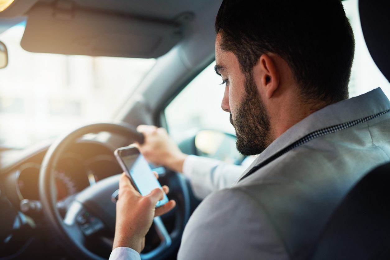 Driver looking at a phone while at the wheel