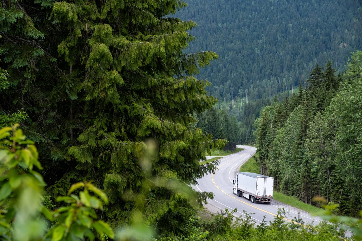 Truck on a scenic road through the Canadian Rockies