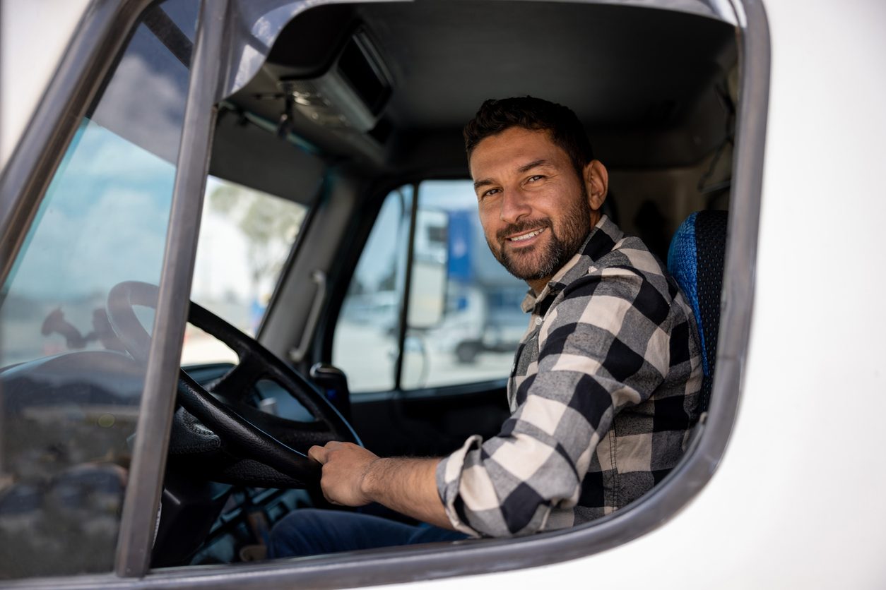 Truck driver at the wheel of his cab