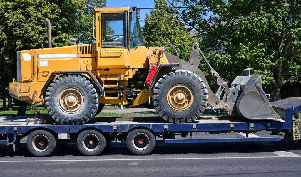 Wheel loader secured on a lowboy trailer