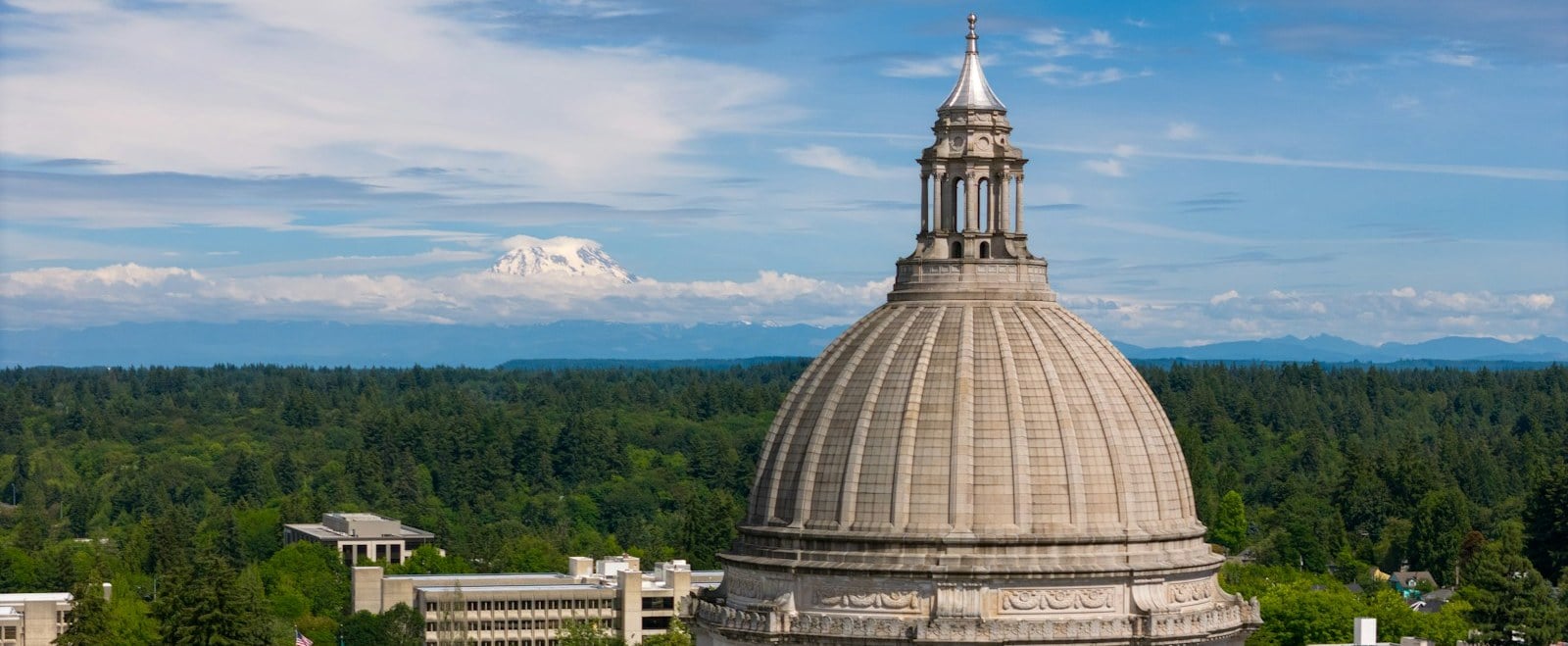 The Washington State Capitol dome in Olympia with Mount Rainier on the horizon